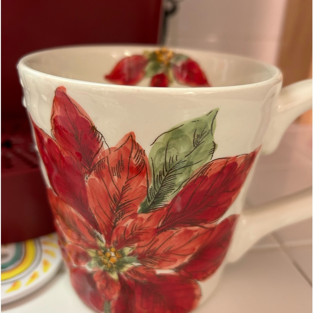 Two lovely poinsettia mugs retired by Maxcera